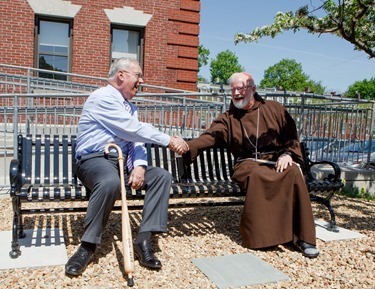 Dedication of a bench in honor of former Boston Mayor Thomas Menino outside Catholic Charities’ Teen Center at St. Peter’s in Dorchester May 12, 2014.  
Pilot photo/ Gregory L. Tracy 
