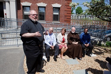 Dedication of a bench in honor of former Boston Mayor Thomas Menino outside Catholic Charities’ Teen Center at St. Peter’s in Dorchester May 12, 2014.  
Pilot photo/ Gregory L. Tracy 
