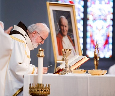 The relic of St. Pope John Paul II is displayed next the altar of the Cathedral of the Holy Cross during Mass Sunday June 22, 2014.  Following the Mass, the relic was carried in procession to the cathedral’s side chapel for veneration. (Pilot photo by Gregory L. Tracy)