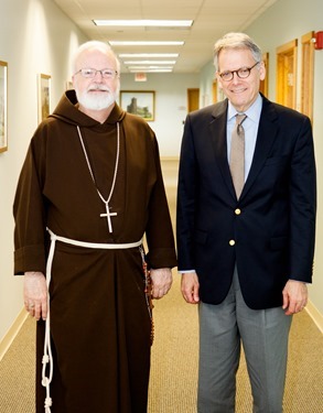 Ambassador Jeffrey DeLaurentis meets with Cardinal Sean P. O’Malley in the cardinal’s Braintree office Aug. 14, 2014. Pilot photo/ Gregory L. Tracy 