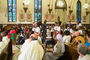 Cardinal Sean P. O’Malley and Cardinal Francis Arinze, who is from Nigeria, celebrate a Mass to mark the 25th anniversary of the Nigerian Catholic Community in the Archdiocese of Boston at St. Katharine Drexel Parish in Dorchester July 26, 2014. (Pilot photo/Christopher S. Pineo)