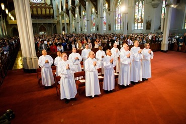 Cardinal Seán P. O'Malley ordains 13 men as permanent deacons at the Cathedral of the Holy Cross Sept. 20, 2014. The newly ordained are: Deacons Francis X. Burke, Michael F. Curren, William A. Dwyer, George C. Escotto, Edward S. Giordano, Charles A. Hall, Franklin A. Mejia, Eric T. Peabody, Jesús M. Pena, Álvaro José L. Soares, Michael P. Tompkins, Jude Tam V. Tran, and Carlos S. Valentin.
Pilot photo/ Gregory L. Tracy 
