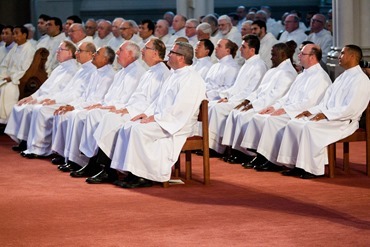 Cardinal Seán P. O'Malley ordains 13 men as permanent deacons at the Cathedral of the Holy Cross Sept. 20, 2014. The newly ordained are: Deacons Francis X. Burke, Michael F. Curren, William A. Dwyer, George C. Escotto, Edward S. Giordano, Charles A. Hall, Franklin A. Mejia, Eric T. Peabody, Jesús M. Pena, Álvaro José L. Soares, Michael P. Tompkins, Jude Tam V. Tran, and Carlos S. Valentin.
Pilot photo/ Gregory L. Tracy 
