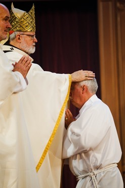 Cardinal Seán P. O'Malley ordains 13 men as permanent deacons at the Cathedral of the Holy Cross Sept. 20, 2014. The newly ordained are: Deacons Francis X. Burke, Michael F. Curren, William A. Dwyer, George C. Escotto, Edward S. Giordano, Charles A. Hall, Franklin A. Mejia, Eric T. Peabody, Jesús M. Pena, Álvaro José L. Soares, Michael P. Tompkins, Jude Tam V. Tran, and Carlos S. Valentin.
Pilot photo/ Gregory L. Tracy 
