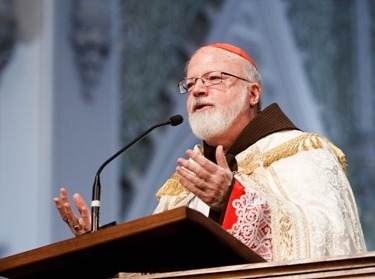 Cardinal Seán P. O'Malley presents the 2014 Cheverus Award Medals for service to the Church to 116 recipients at a Vespers Service at the Cathedral of the Holy Cross Nov. 23, 2014. Afterward, the cardinal joined the recipients and their families at a reception in neighboring Cathedral High School.<br />
Pilot photo/ Gregory L. Tracy<br />
