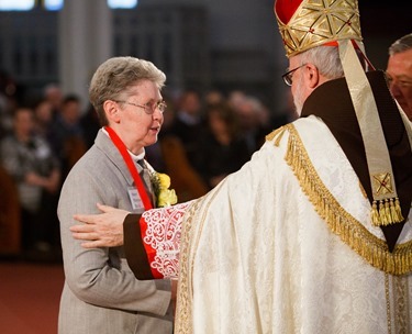 Cardinal Seán P. O'Malley presents the 2014 Cheverus Award Medals for service to the Church to 116 recipients at a Vespers Service at the Cathedral of the Holy Cross Nov. 23, 2014. Afterward, the cardinal joined the recipients and their families at a reception in neighboring Cathedral High School.<br />
Pilot photo/ Gregory L. Tracy<br />
