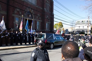 Mourners gather outside Most Precious Blood Church in Hyde Park for the Funeral Mass for former Boston mayor Thomas M. Menino Nov. 3, 2014.  The former mayor died Oct. 30 just week after announcing that he was suspending his treatment for cancer.<br />
Pilot photo/ Christopher S. Pineo<br />
