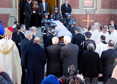 Mourners gather outside Most Precious Blood Church in Hyde Park for the Funeral Mass for former Boston mayor Thomas M. Menino Nov. 3, 2014.  The former mayor died Oct. 30 just week after announcing that he was suspending his treatment for cancer.<br />
Pilot photo/ Christopher S. Pineo<br />
