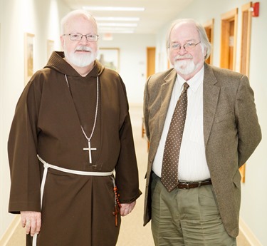 Cardinal Sean P. O'Malley is pictured with retiring archivist of the Archdiocese of Boston, Robert Johnson-Lally in the cardinal’s offices, Jan. 7, 2015. Johnson-Lally retired Dec. 31, 2014 after serving the archdiocese from more than 20 years.
Pilot photo/ Gregory L. Tracy 
