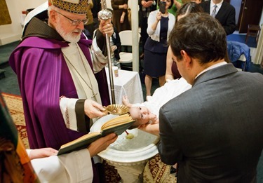 Baptism of Olivia Isabel Enrique at Our Lady of the Assumption Parish, East Boston, Jan. 4, 2015.
Photo by Gregory L. Tracy