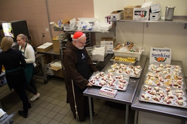 Cardinal Seán P. O'Malley visits Pine Street Inn homeless shelter in Boston Dec. 24, 2104.
Pilot photo/ Christopher S. Pineo 
