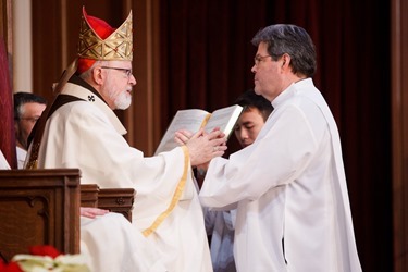 Cardinal Sean P. O’Malley ordains Anthony Cusack, Andrea Filippucci, Christopher Lowe, Peter Stamm, and Sinisa Ubiparipovic transitional deacons at the Cathedral of the Holy Cross Jan. 10, 2015.
Pilot photo/ Gregory L. Tracy 