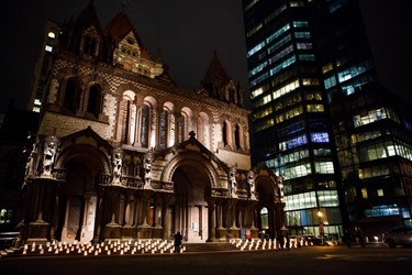 Votive candle holders with messages remembering victims of the Armenian genocide sit on the steps of the Trinity Church in Boston April 23 during an ecumenical prayer service to mark the centennial of the genocide during which 1.5 people are believed to have perished.
Pilot photo/ Gregory L. Tracy 
