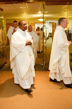 Cardinal Seán P. O'Malley formally accepts Father Garcia Brenneville as a priest of the Archdiocese of Boston in a ritual known as incardination at the archdiocese’s Pastoral Center April 7, 2015.  Father Brenneville is a native of Port-Au-Prince, Haiti, and he serves as parochial vicar at Christ the King Parish, St. Edith Stein Parish and Our Lady of Lourdes Parish in Brockton.  (Pilot photo/ Gregory L. Tracy)