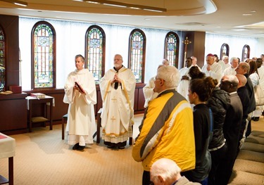 Cardinal Seán P. O'Malley formally accepts Father Garcia Brenneville as a priest of the Archdiocese of Boston in a ritual known as incardination at the archdiocese’s Pastoral Center April 7, 2015.  Father Brenneville is a native of Port-Au-Prince, Haiti, and he serves as parochial vicar at Christ the King Parish, St. Edith Stein Parish and Our Lady of Lourdes Parish in Brockton.  (Pilot photo/ Gregory L. Tracy)