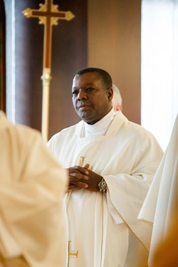 Cardinal Seán P. O'Malley formally accepts Father Garcia Brenneville as a priest of the Archdiocese of Boston in a ritual known as incardination at the archdiocese’s Pastoral Center April 7, 2015.  Father Brenneville is a native of Port-Au-Prince, Haiti, and he serves as parochial vicar at Christ the King Parish, St. Edith Stein Parish and Our Lady of Lourdes Parish in Brockton.  (Pilot photo/ Gregory L. Tracy)