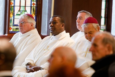 Cardinal Seán P. O'Malley formally accepts Father Garcia Brenneville as a priest of the Archdiocese of Boston in a ritual known as incardination at the archdiocese’s Pastoral Center April 7, 2015.  Father Brenneville is a native of Port-Au-Prince, Haiti, and he serves as parochial vicar at Christ the King Parish, St. Edith Stein Parish and Our Lady of Lourdes Parish in Brockton.  (Pilot photo/ Gregory L. Tracy)