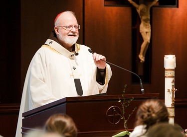 Cardinal Seán P. O'Malley formally accepts Father Garcia Brenneville as a priest of the Archdiocese of Boston in a ritual known as incardination at the archdiocese’s Pastoral Center April 7, 2015.  Father Brenneville is a native of Port-Au-Prince, Haiti, and he serves as parochial vicar at Christ the King Parish, St. Edith Stein Parish and Our Lady of Lourdes Parish in Brockton.  (Pilot photo/ Gregory L. Tracy)