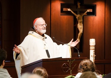 Cardinal Seán P. O'Malley formally accepts Father Garcia Brenneville as a priest of the Archdiocese of Boston in a ritual known as incardination at the archdiocese’s Pastoral Center April 7, 2015.  Father Brenneville is a native of Port-Au-Prince, Haiti, and he serves as parochial vicar at Christ the King Parish, St. Edith Stein Parish and Our Lady of Lourdes Parish in Brockton.  (Pilot photo/ Gregory L. Tracy)