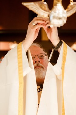 Cardinal Seán P. O'Malley formally accepts Father Garcia Brenneville as a priest of the Archdiocese of Boston in a ritual known as incardination at the archdiocese’s Pastoral Center April 7, 2015.  Father Brenneville is a native of Port-Au-Prince, Haiti, and he serves as parochial vicar at Christ the King Parish, St. Edith Stein Parish and Our Lady of Lourdes Parish in Brockton.  (Pilot photo/ Gregory L. Tracy)