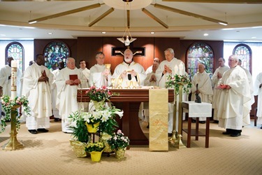 Cardinal Seán P. O'Malley formally accepts Father Garcia Brenneville as a priest of the Archdiocese of Boston in a ritual known as incardination at the archdiocese’s Pastoral Center April 7, 2015.  Father Brenneville is a native of Port-Au-Prince, Haiti, and he serves as parochial vicar at Christ the King Parish, St. Edith Stein Parish and Our Lady of Lourdes Parish in Brockton.  (Pilot photo/ Gregory L. Tracy)