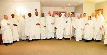 Cardinal Seán P. O'Malley formally accepts Father Garcia Brenneville as a priest of the Archdiocese of Boston in a ritual known as incardination at the archdiocese’s Pastoral Center April 7, 2015.  Father Brenneville is a native of Port-Au-Prince, Haiti, and he serves as parochial vicar at Christ the King Parish, St. Edith Stein Parish and Our Lady of Lourdes Parish in Brockton.  (Pilot photo/ Gregory L. Tracy)