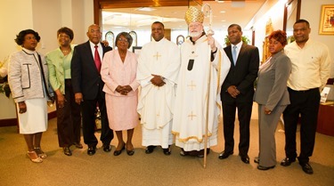 Cardinal Seán P. O'Malley formally accepts Father Garcia Brenneville as a priest of the Archdiocese of Boston in a ritual known as incardination at the archdiocese’s Pastoral Center April 7, 2015.  Father Brenneville is a native of Port-Au-Prince, Haiti, and he serves as parochial vicar at Christ the King Parish, St. Edith Stein Parish and Our Lady of Lourdes Parish in Brockton.  (Pilot photo/ Gregory L. Tracy)