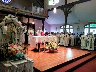 A Mass and festival was held Aug. 9, 2015 at St. Mary of the Assumption in Hull to mark three special occasions of the parish: the 5th anniversary of their feast day celebration, the 125th anniversary of the parish and the 100th anniversary of their church. 
Pilot photo/ Courtesy St. Mary of the Assumption Parish
