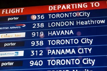 The departures board at Logan International Airport displays the pilgrims’ flight to Cuba.
Pilot photo/ Gregory L. Tracy
