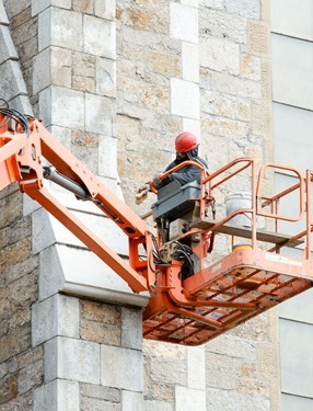 New bells for the Cathedral of the Holy Cross that came from the closed Holy Trinity Church in the South End are lifted in the cathedral’s belltower Oct. 23, 2015.
Pilot photo/ Gregory L. Tracy 
