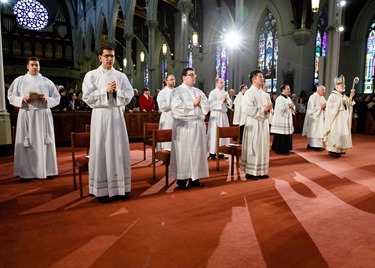 Ordination of Transitional Deacons Chris Bae, Matthew Conley, Patrick Fiorillo, Thomas Gignac, Stephen LeBlanc, Huan Ngo and Thomas Sullivan at the Cathedral of the Holy Cross Jan. 9, 2015. Pilot photo/ Gregory L. Tracy