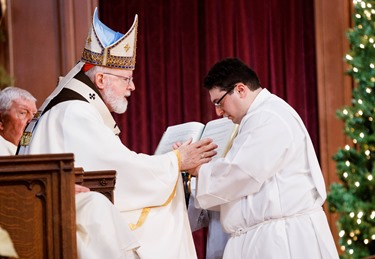 Ordination of Transitional Deacons Chris Bae, Matthew Conley, Patrick Fiorillo, Thomas Gignac, Stephen LeBlanc, Huan Ngo and Thomas Sullivan at the Cathedral of the Holy Cross Jan. 9, 2015. Pilot photo/ Gregory L. Tracy