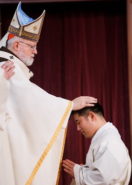 Ordination of Transitional Deacons Chris Bae, Matthew Conley, Patrick Fiorillo, Thomas Gignac, Stephen LeBlanc, Huan Ngo and Thomas Sullivan at the Cathedral of the Holy Cross Jan. 9, 2015. Pilot photo/ Gregory L. Tracy