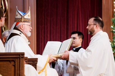 Ordination of Transitional Deacons Chris Bae, Matthew Conley, Patrick Fiorillo, Thomas Gignac, Stephen LeBlanc, Huan Ngo and Thomas Sullivan at the Cathedral of the Holy Cross Jan. 9, 2015. Pilot photo/ Gregory L. Tracy