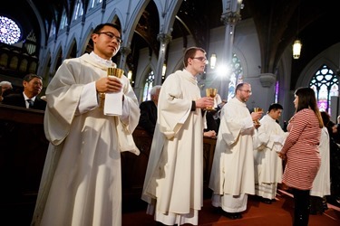 Ordination of Transitional Deacons Chris Bae, Matthew Conley, Patrick Fiorillo, Thomas Gignac, Stephen LeBlanc, Huan Ngo and Thomas Sullivan at the Cathedral of the Holy Cross Jan. 9, 2015. Pilot photo/ Gregory L. Tracy