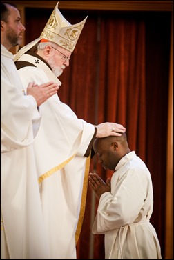 Transitional diaconate ordination of Deacons Jason Giombetti, Pablo Gomis Gonzalez, Godfrey Musabe, Wellington DeOliveira, Joel Santos and William Sexton at the Cathedral of the Holy Cross, April 30, 2016. The men will be ordained to the priesthood in 2017. Pilot photo/ Gregory L. Tracy 