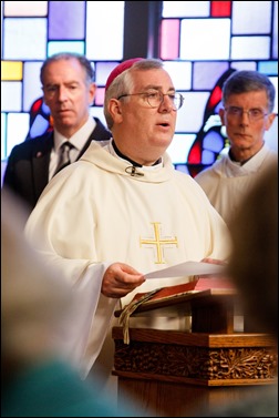 Bishops-elect Robert Reed and Mark O’Connell take their Oath of Fidelity before Cardinal O’Malley during a Mass broadcast live on CatholicTV Aug. 12, 2016. During the Mass, the cardinal also blessed the insignia — crossiers, mitres and rings — that the bishops will receive at their ordination.
Pilot photo/ Gregory L. Tracy 
