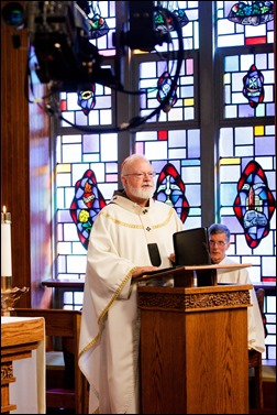 Bishops-elect Robert Reed and Mark O’Connell take their Oath of Fidelity before Cardinal O’Malley during a Mass broadcast live on CatholicTV Aug. 12, 2016. During the Mass, the cardinal also blessed the insignia — crossiers, mitres and rings — that the bishops will receive at their ordination.
Pilot photo/ Gregory L. Tracy 
