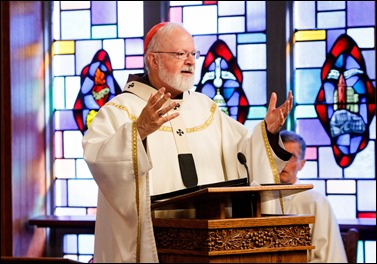 Bishops-elect Robert Reed and Mark O’Connell take their Oath of Fidelity before Cardinal O’Malley during a Mass broadcast live on CatholicTV Aug. 12, 2016. During the Mass, the cardinal also blessed the insignia — crossiers, mitres and rings — that the bishops will receive at their ordination.
Pilot photo/ Gregory L. Tracy 
