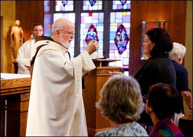 Bishops-elect Robert Reed and Mark O’Connell take their Oath of Fidelity before Cardinal O’Malley during a Mass broadcast live on CatholicTV Aug. 12, 2016. During the Mass, the cardinal also blessed the insignia — crossiers, mitres and rings — that the bishops will receive at their ordination.
Pilot photo/ Gregory L. Tracy 
