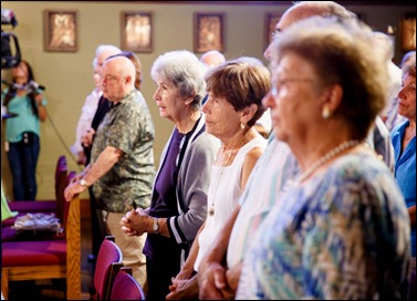 Bishops-elect Robert Reed and Mark O’Connell take their Oath of Fidelity before Cardinal O’Malley during a Mass broadcast live on CatholicTV Aug. 12, 2016. During the Mass, the cardinal also blessed the insignia — crossiers, mitres and rings — that the bishops will receive at their ordination.
Pilot photo/ Gregory L. Tracy 
