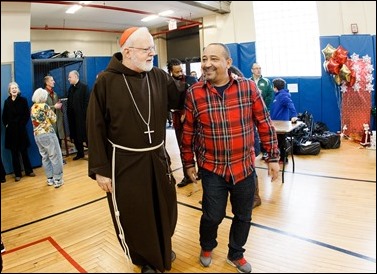 Cardinal O’Malley visits the Teen Center and St. Peter’s in Dorchester Saturday, Dec. 24, 2016. In partnership with the Menino family, Catholic Charities of Boston distributed Christmas gifts to nearly 400 children and families in need.
Pilot photo/ Gregory L. Tracy
