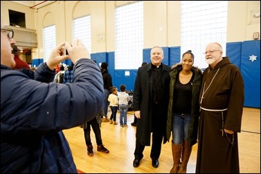 Cardinal O’Malley visits the Teen Center and St. Peter’s in Dorchester Saturday, Dec. 24, 2016. In partnership with the Menino family, Catholic Charities of Boston distributed Christmas gifts to nearly 400 children and families in need.
Pilot photo/ Gregory L. Tracy
