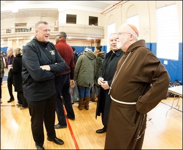 Cardinal O’Malley visits the Teen Center and St. Peter’s in Dorchester Saturday, Dec. 24, 2016. In partnership with the Menino family, Catholic Charities of Boston distributed Christmas gifts to nearly 400 children and families in need.
Pilot photo/ Gregory L. Tracy
