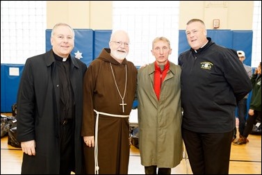 Cardinal O’Malley visits the Teen Center and St. Peter’s in Dorchester Saturday, Dec. 24, 2016. In partnership with the Menino family, Catholic Charities of Boston distributed Christmas gifts to nearly 400 children and families in need.
Pilot photo/ Gregory L. Tracy
