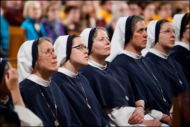 Religious women listen as New York Cardinal Timothy Dolan delivers his homily at Vigil Mass for Life, held Jan. 26 at the Basilica of the National Shrine of the Immaculate Conception in Washington, D.C. Pilot photo/ Gregory L. Tracy 