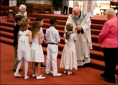 First Communions celebrated at the Cathedral of the Holy Cross, May 7, 2017. Pilot photo by Mark Labbe