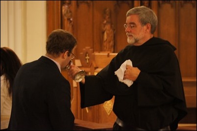 Adopt_08_Father Peter G. Gori presents the congregation the relic before blessing