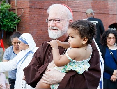 Cardinal O’Malley, priests and other religious leaders participate in a walk for peace in Dorchester, July 11, 2017. Pilot photo/ Mark Labbe 