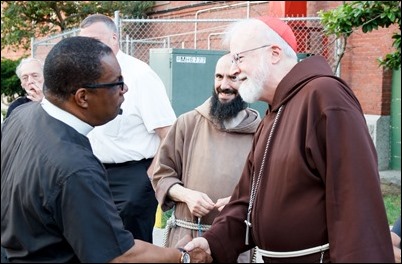 Cardinal O’Malley, priests and other religious leaders participate in a walk for peace in Dorchester, July 11, 2017. Pilot photo/ Mark Labbe 